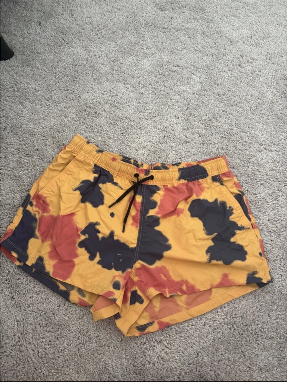 Mountain Hardwear Yellow Tie-Dye Athletic Shorts with Black and Rust Accents